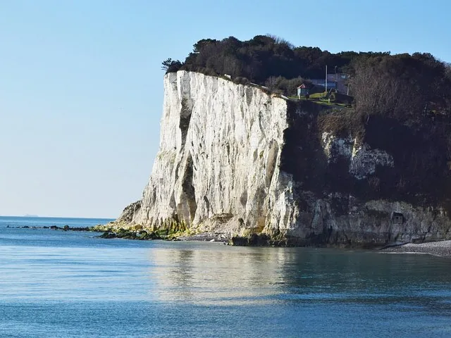 White Cliffs of Dover rising steeply above the calm ocean waters