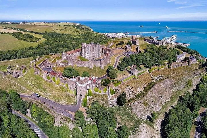 Aerial view of Dover Castle perched on a hill above the harbor