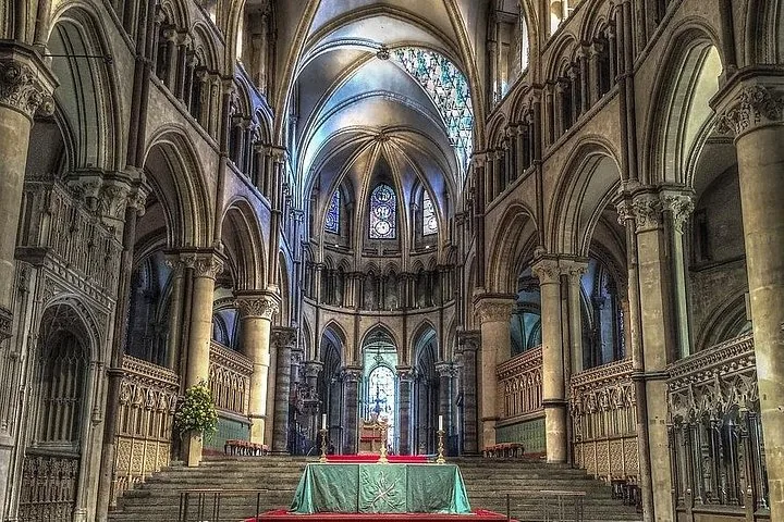 Interior view of a grand historic cathedral with vaulted ceilings