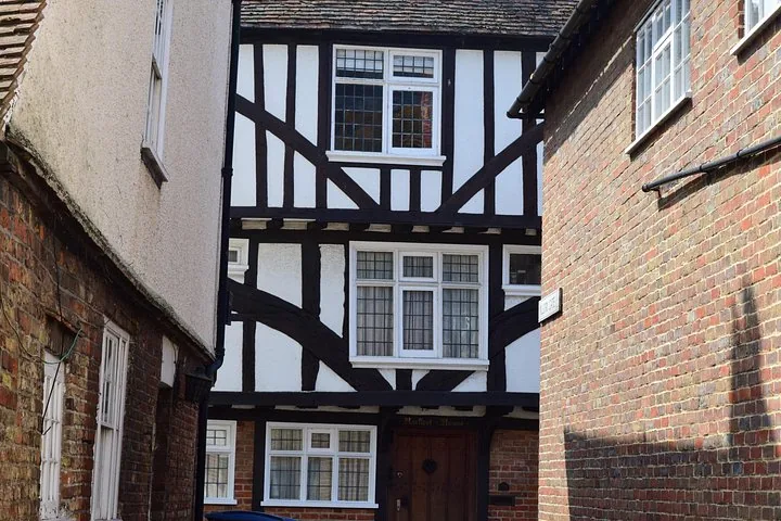 Close-up of a traditional Tudor half-timbered building in a narrow alley